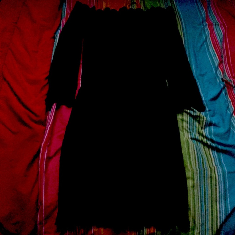A black off the shoulder dress